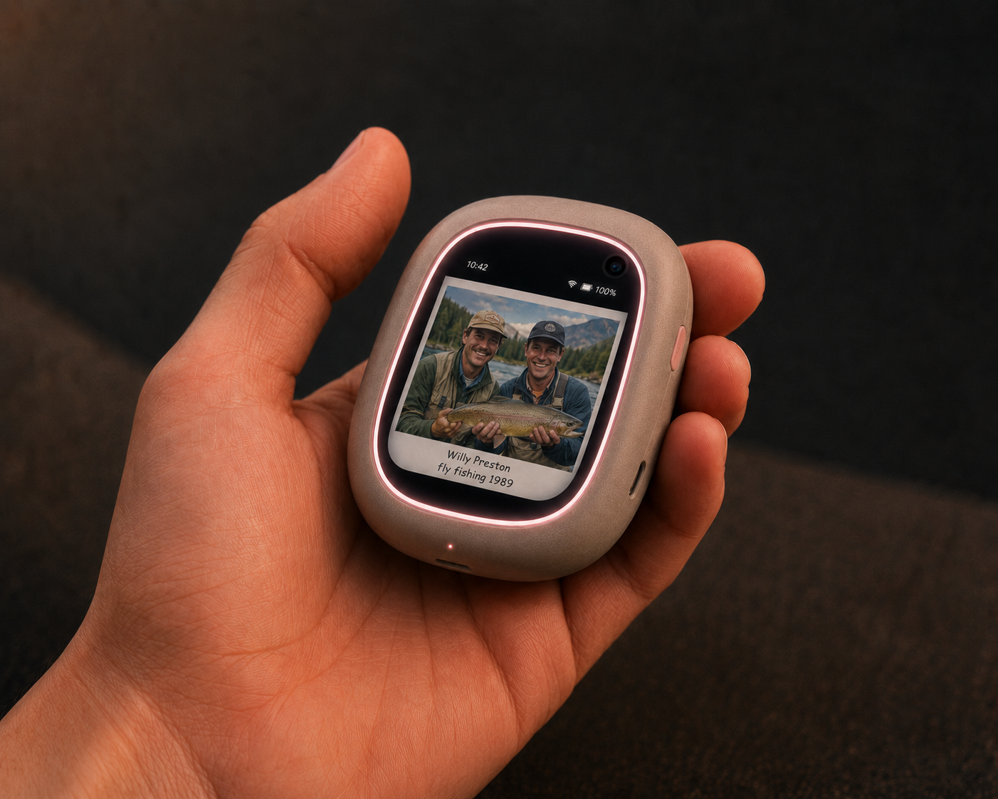 A hand holding a companion device showing an old photo of two friends fly fishing, labeled Willy Preston, fly fishing 1989